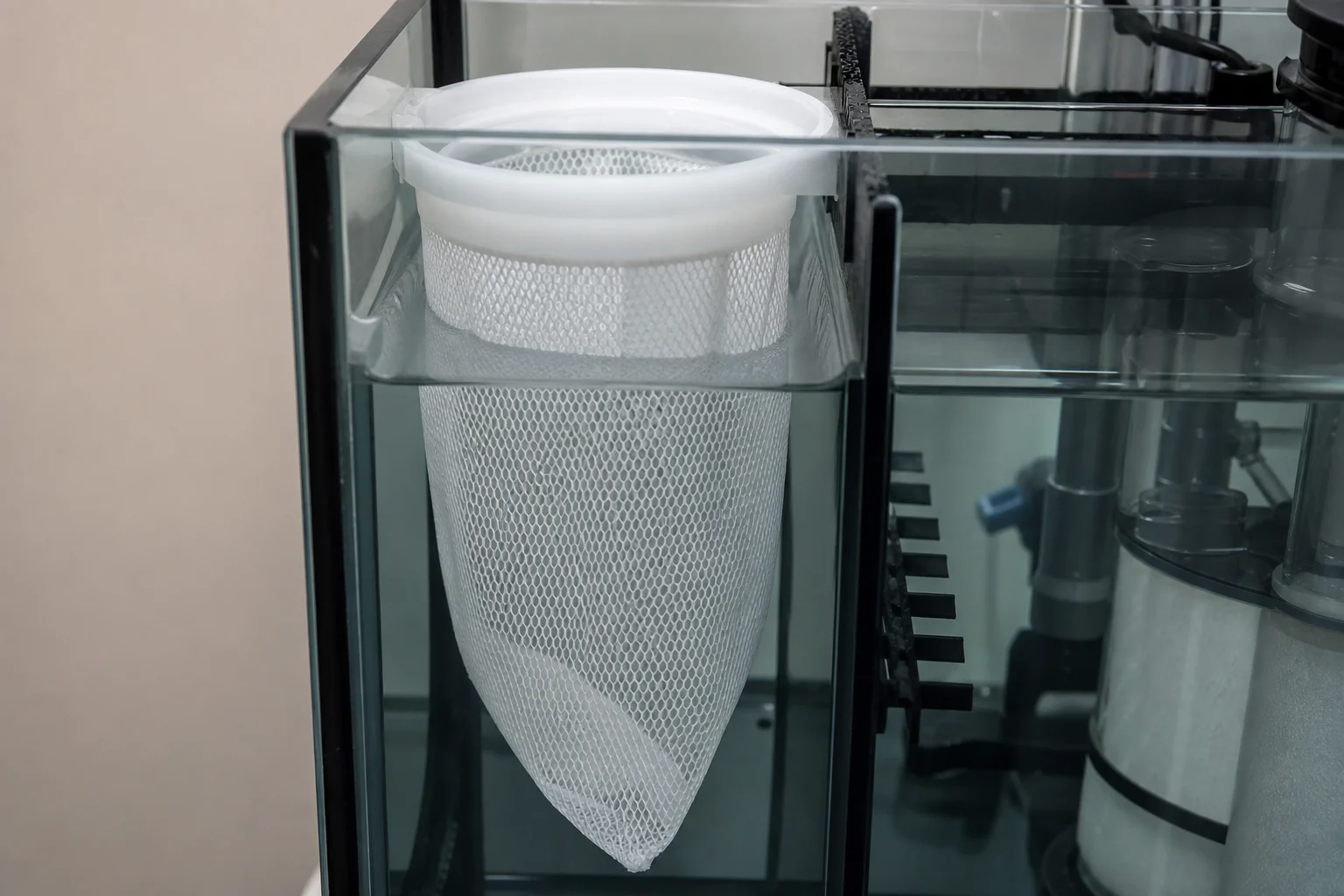 Aquarium filter sock installed in first chamber of all-in-one tank