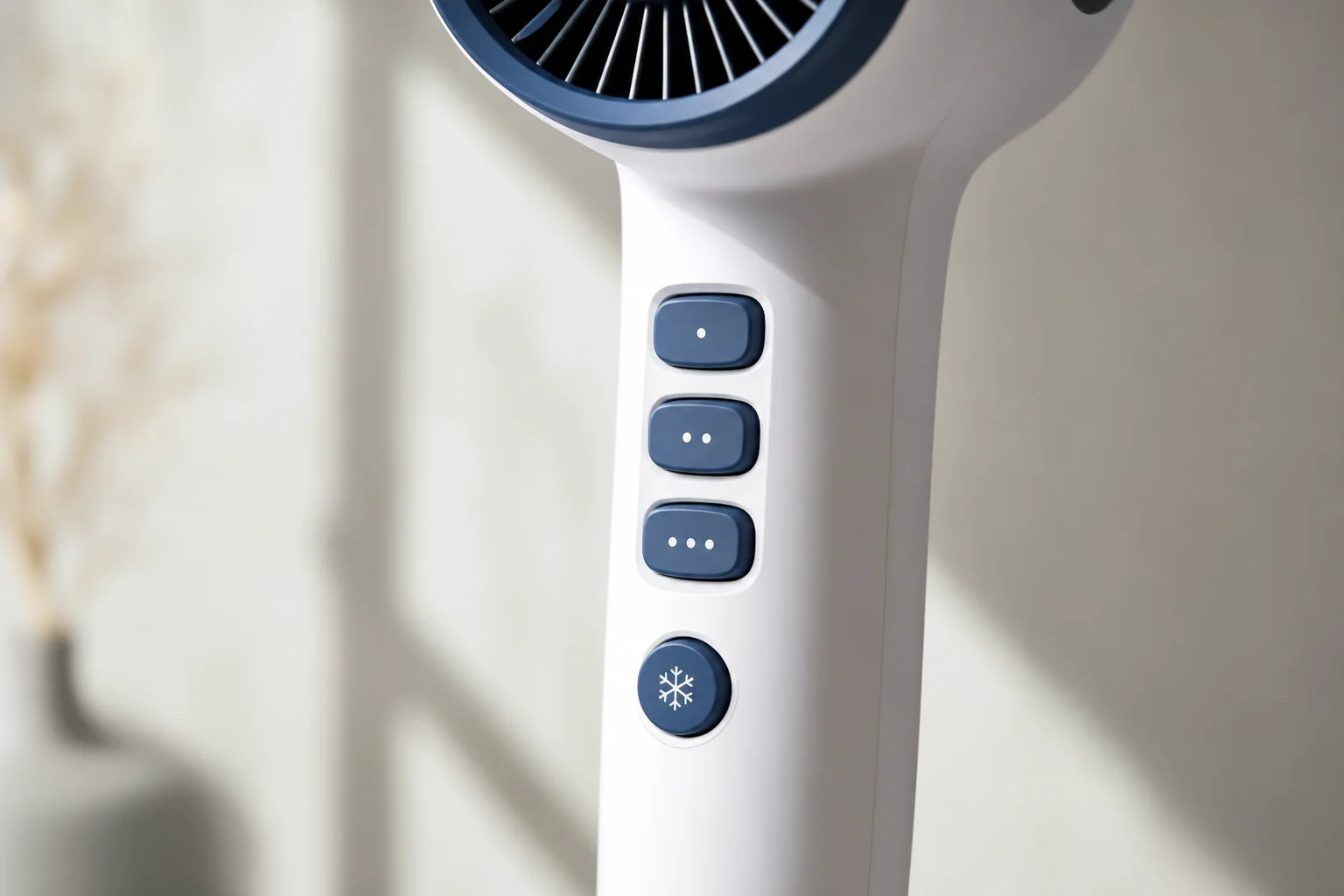 Hair dryer power button with three heat speed settings and cool shot button