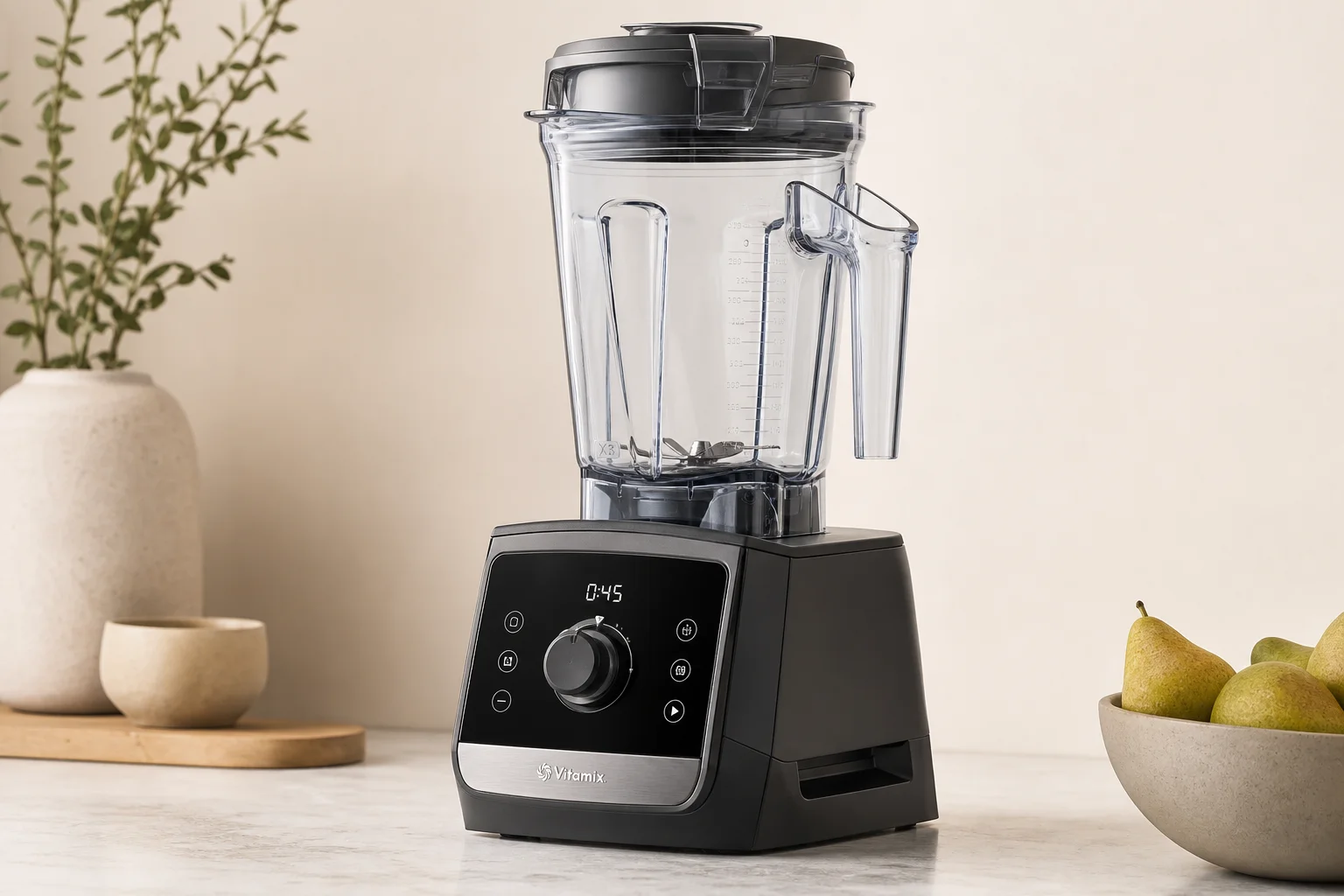 Five Vitamix blender models arranged by size and design progression on concrete