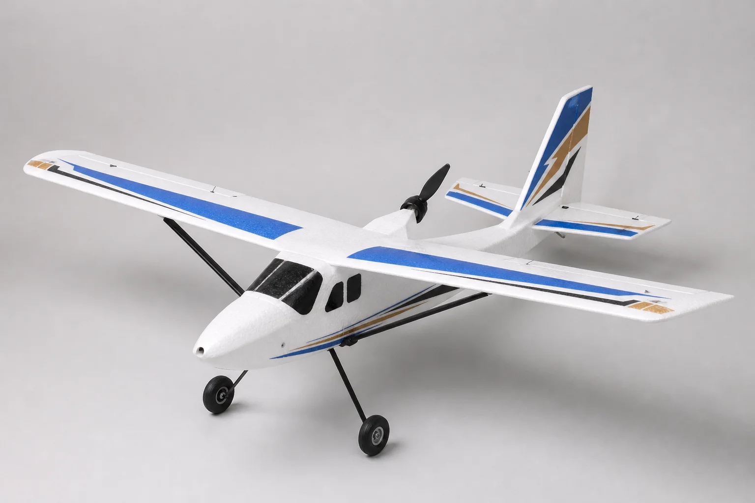 Five beginner RC planes displayed on neutral backdrop