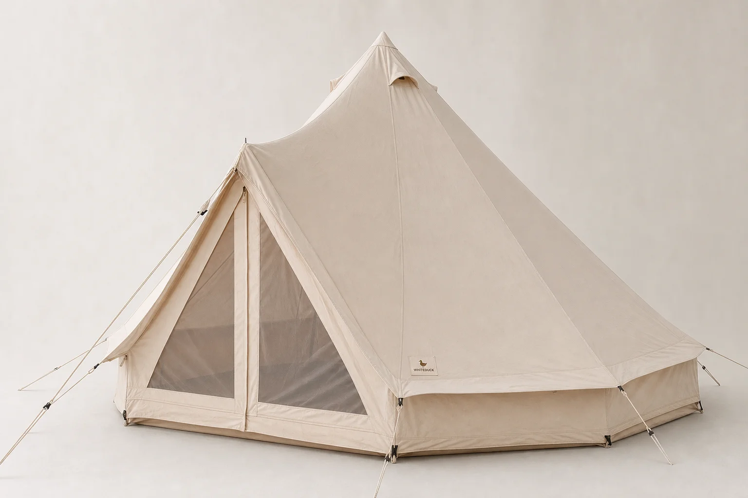 Seven survival tents of varying sizes and styles arranged on neutral backdrop