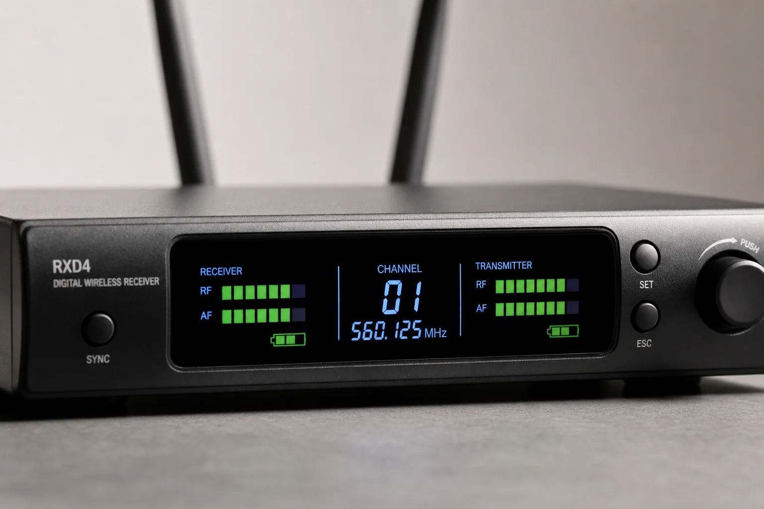 Close-up of wireless receiver LED display showing battery and signal indicators