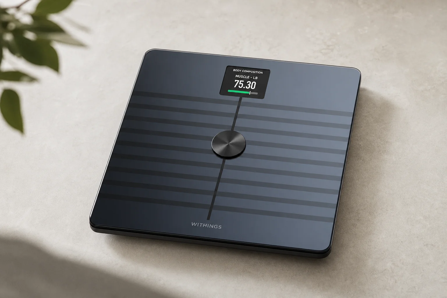 Collection of health monitoring devices including air quality monitor, smartwatch, scale, and sleep technology on wooden surface