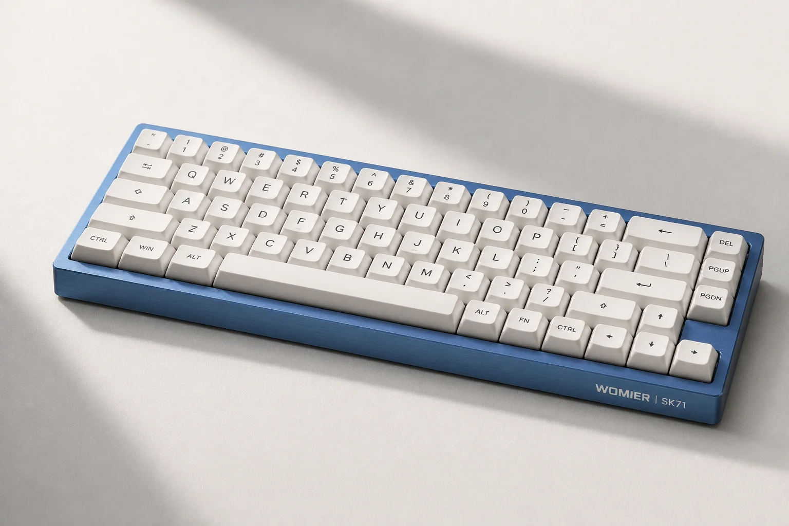 Six budget mechanical keyboards arranged on concrete surface showing variety of styles and colors