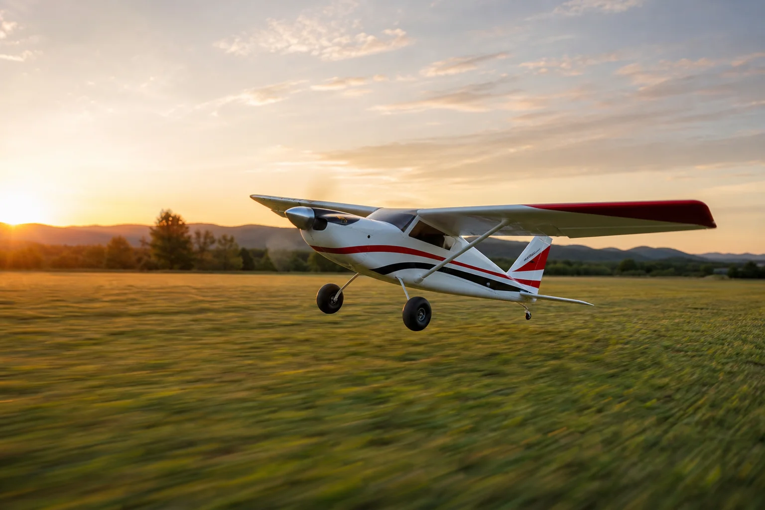RC aircraft taking off from grass field with full throttle