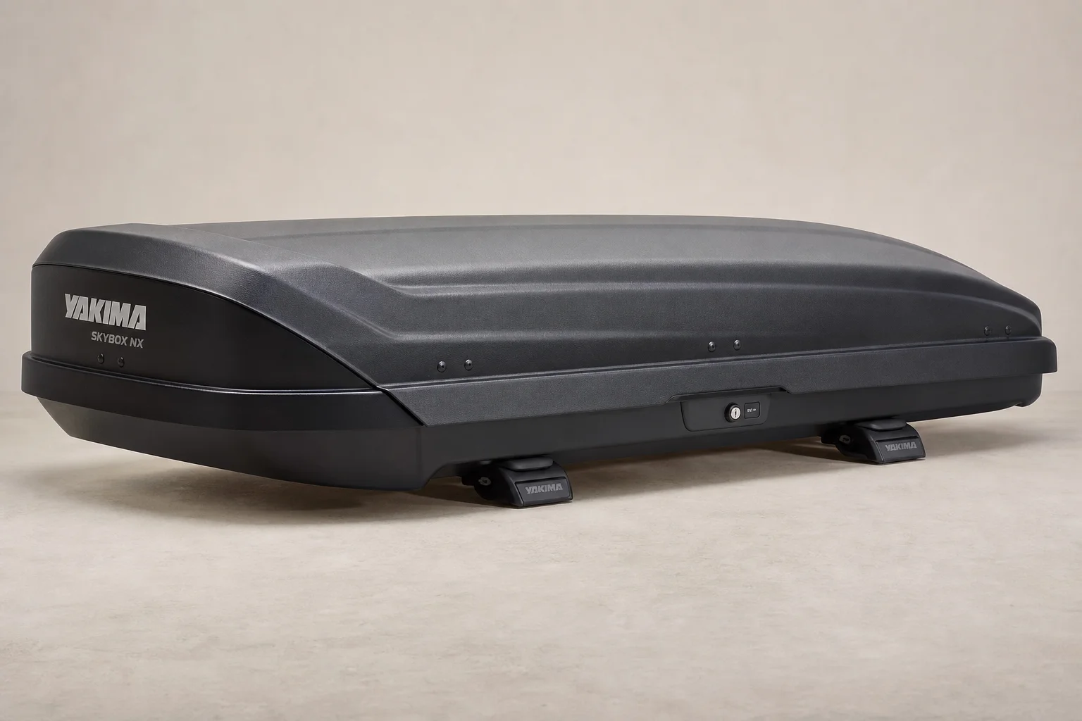 Rooftop cargo box mounted on vehicle roof rack with aerodynamic design