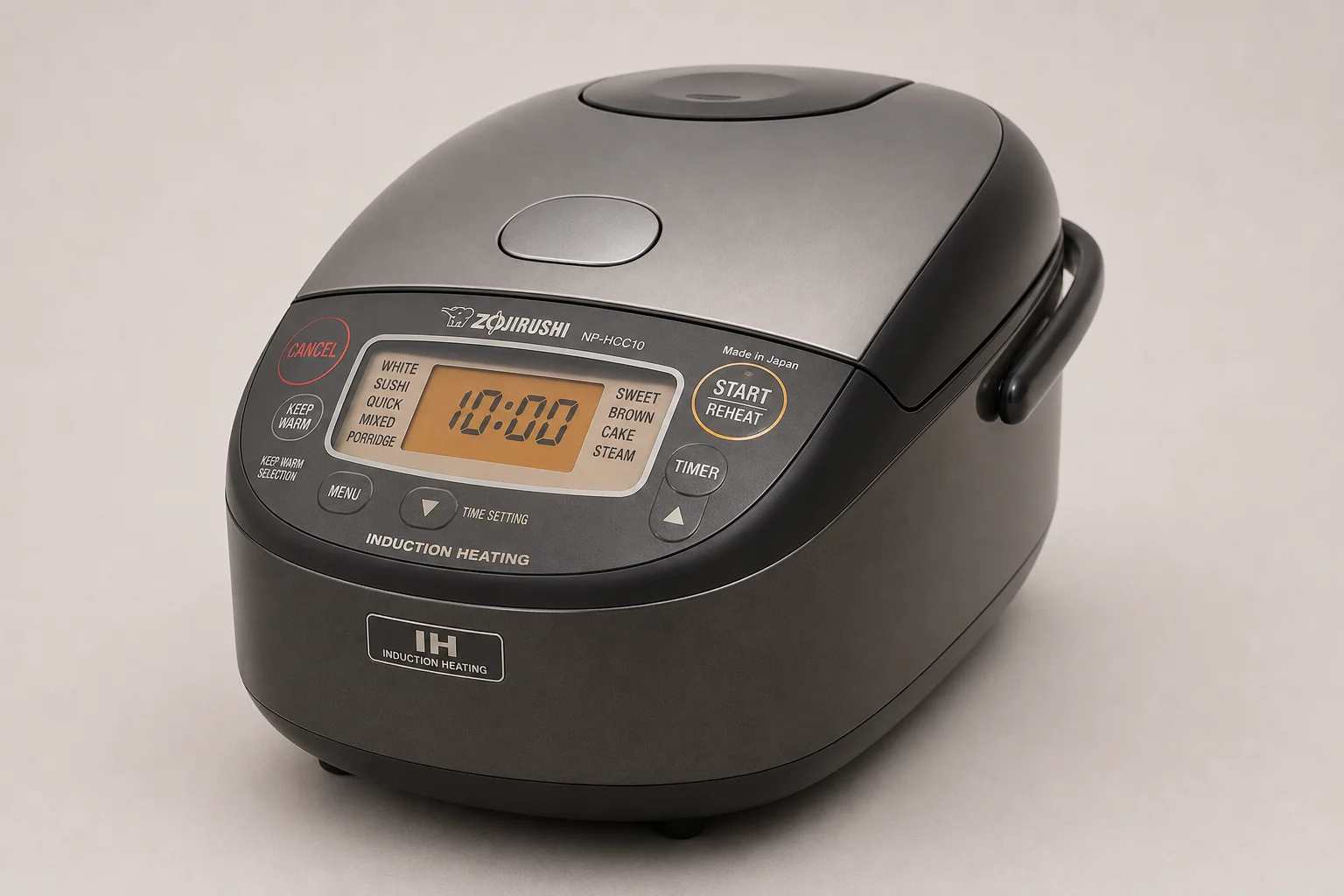 Tiger and Zojirushi rice cookers side by side on neutral background