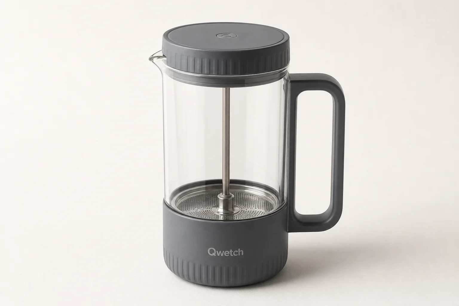 Five portable coffee makers arranged on concrete: Zyliss mug, Coffee Gator travel mug, Espro press, Bodum French press, and AeroPress Go